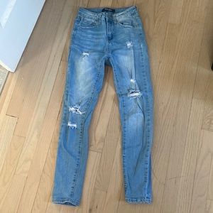 Light blue ripped jeans